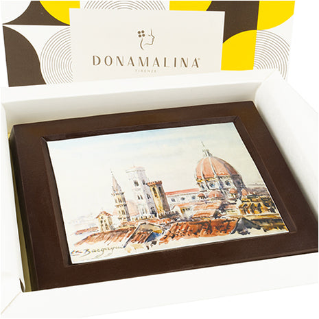 Quatro in ciococlato fondente con veduta di Firenze realizzata in stile acquerello su carta alimentware con colori alimentari, e sullo sfondo box Donamalina a fantasia gialla e marrone.
